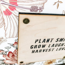 Load image into Gallery viewer, Plant Smiles, Grow Laughter, Harvest Love Sign
